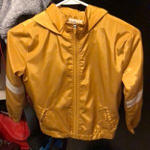 26 international. Gold “Love” windbreaker.